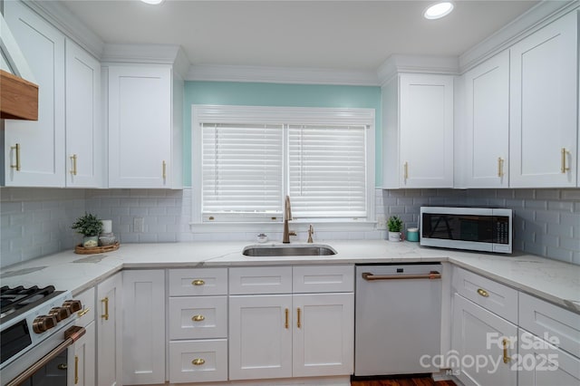 806 S Point Rd, Belmont, NC 28012 - kitchen featuring stainless steel appliances, white cabinetry, decorative backsplash, ornamental molding, and recessed lighting