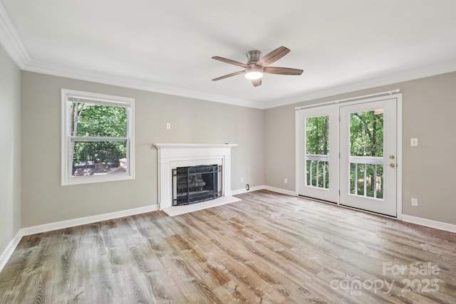 8 Hickory Ridge Ct, Clover, SC 29710 - unfurnished living room featuring plenty of natural light, a ceiling fan, a fireplace with flush hearth, ornamental molding, and wood finished floors
