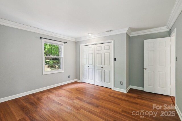 8 Hickory Ridge Ct, Clover, SC 29710 - unfurnished bedroom with wood finished floors, ornamental molding, and a closet