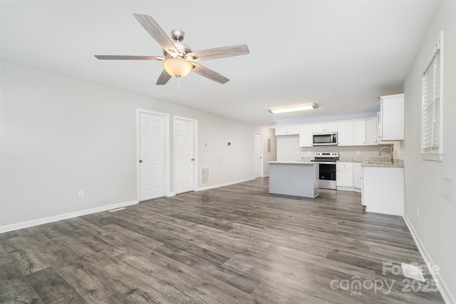 8107 Smith Rd, Kannapolis, NC 28081 - unfurnished living room featuring dark wood finished floors and a ceiling fan