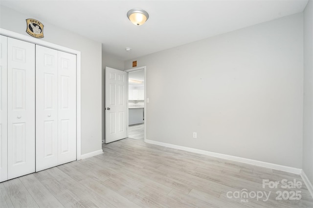 8107 Smith Rd, Kannapolis, NC 28081 - unfurnished bedroom featuring light wood-style floors and a closet