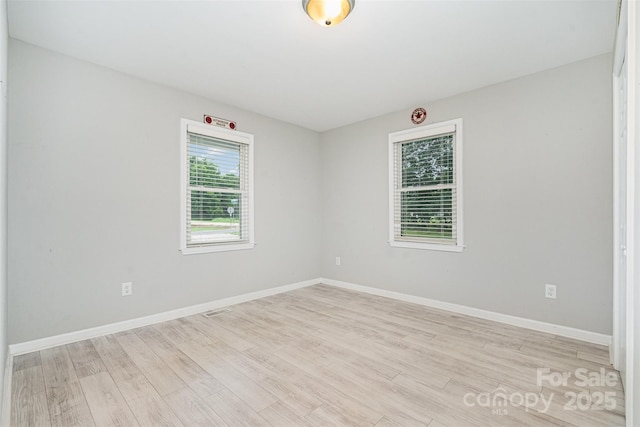 8107 Smith Rd, Kannapolis, NC 28081 - empty room with light wood finished floors and baseboards