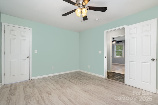 8107 Smith Rd, Kannapolis, NC 28081 - unfurnished bedroom featuring light wood-type flooring and ceiling fan