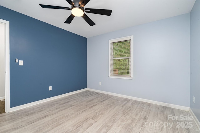 8107 Smith Rd, Kannapolis, NC 28081 - empty room with light wood-style floors and a ceiling fan