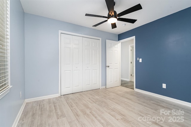 8107 Smith Rd, Kannapolis, NC 28081 - unfurnished bedroom featuring wood finished floors, a closet, and a ceiling fan