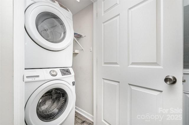 8107 Smith Rd, Kannapolis, NC 28081 - laundry area with estacked washer and dryer and wood finished floors