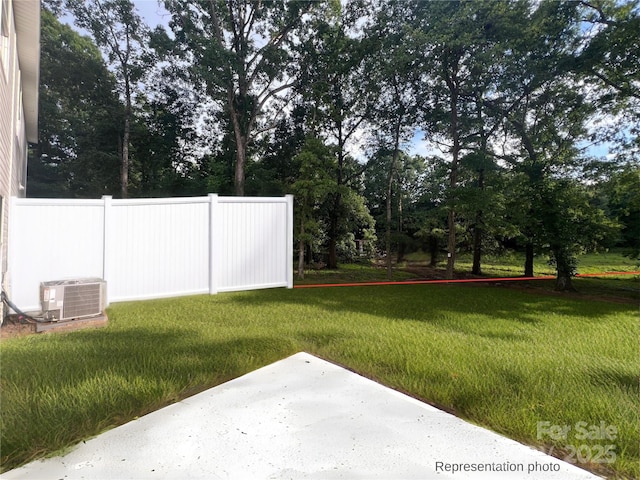 12518 Susanna Dr, Charlotte, NC 28214 - view of yard with a patio and view of wooded area