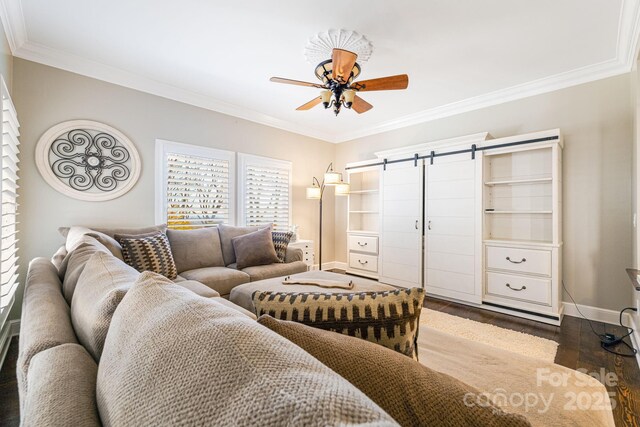 11 By The Wayside Dr, Columbus, NC 28722 - living room featuring crown molding, a ceiling fan, a barn door, and dark wood-type flooring