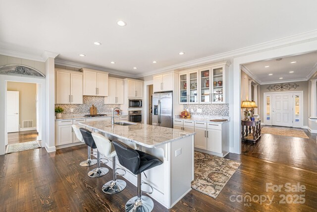11 By The Wayside Dr, Columbus, NC 28722 - kitchen featuring appliances with stainless steel finishes, a breakfast bar, dark wood-type flooring, backsplash, and recessed lighting