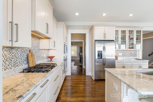 11 By The Wayside Dr, Columbus, NC 28722 - kitchen with appliances with stainless steel finishes, crown molding, white cabinets, glass insert cabinets, and dark wood-type flooring