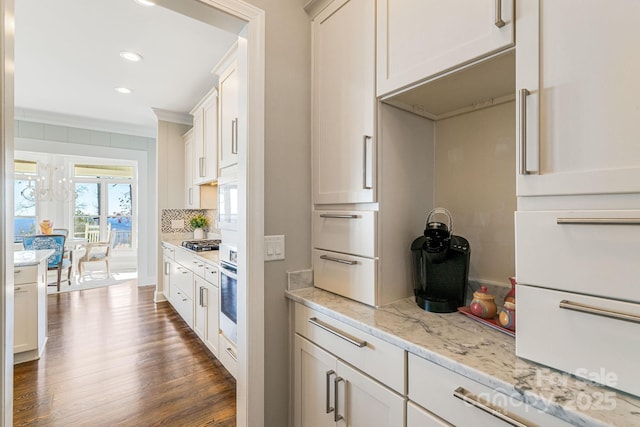 11 By The Wayside Dr, Columbus, NC 28722 - kitchen featuring dark wood-style flooring, oven, stainless steel gas stovetop, light stone counters, and recessed lighting