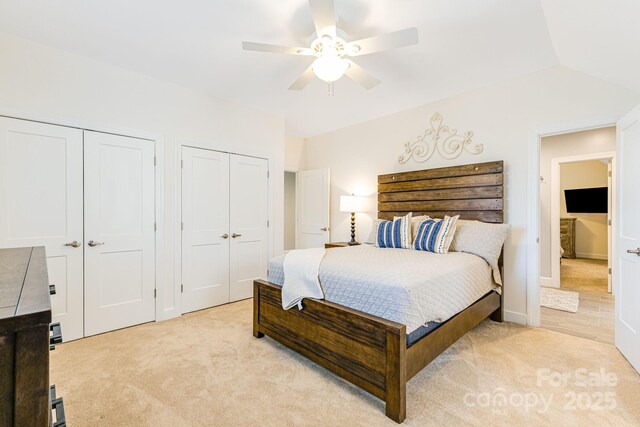 11 By The Wayside Dr, Columbus, NC 28722 - bedroom featuring two closets, light colored carpet, and a ceiling fan