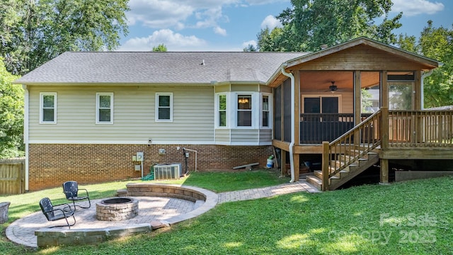 13 Fox Ridge Dr, Granite Falls, NC 28630 - back of house with a sunroom, an outdoor fire pit, ceiling fan, and a lawn