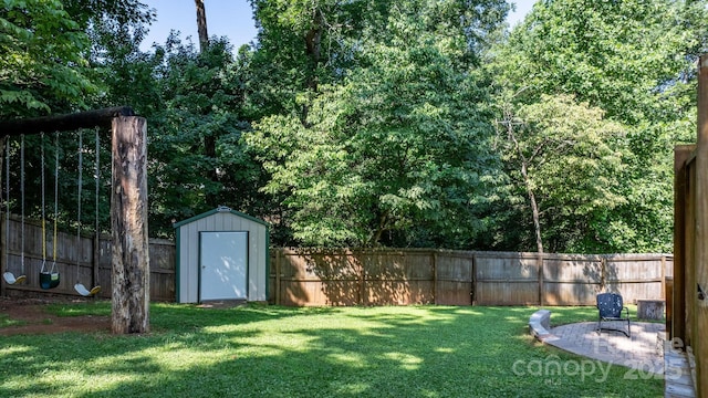 13 Fox Ridge Dr, Granite Falls, NC 28630 - fenced backyard featuring a storage unit