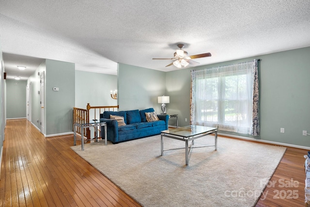 13 Fox Ridge Dr, Granite Falls, NC 28630 - living area featuring ceiling fan, a textured ceiling, wood-type flooring, and a chandelier