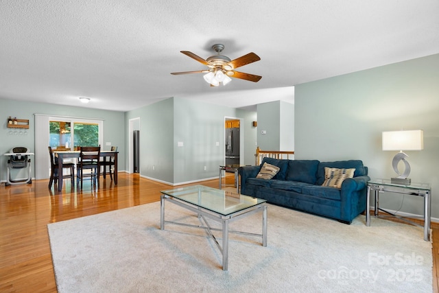 13 Fox Ridge Dr, Granite Falls, NC 28630 - living room with a ceiling fan, light wood-type flooring, and a textured ceiling