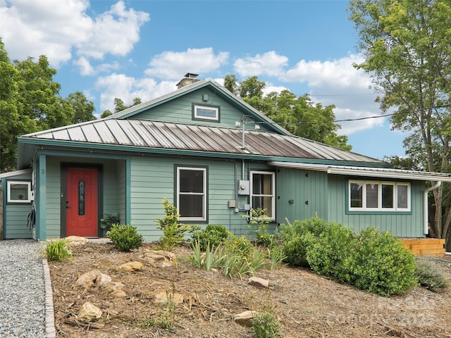 2 Briarwood Dr, Alexander, NC 28701 - view of front of house with a chimney, a metal roof, and board and batten siding