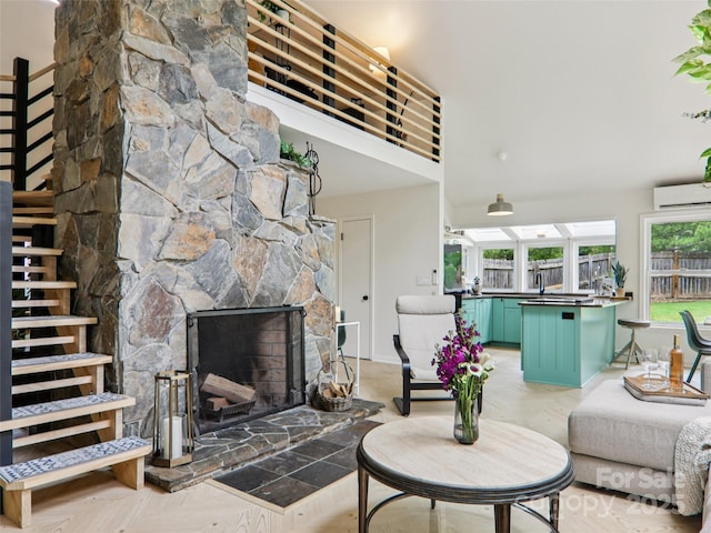 2 Briarwood Dr, Alexander, NC 28701 - living room featuring a wall unit AC and a stone fireplace