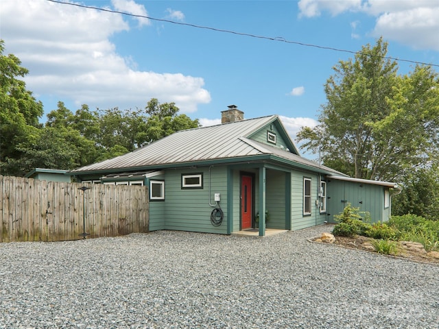 2 Briarwood Dr, Alexander, NC 28701 - view of front of home featuring a chimney, a standing seam roof, and a metal roof