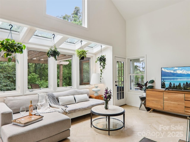 2 Briarwood Dr, Alexander, NC 28701 - living area featuring high vaulted ceiling, healthy amount of natural light, and a skylight