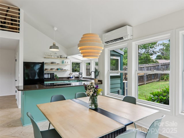 2 Briarwood Dr, Alexander, NC 28701 - dining space with an AC wall unit and vaulted ceiling