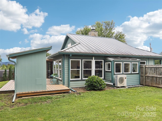 2 Briarwood Dr, Alexander, NC 28701 - back of house with a chimney, a wooden deck, and a metal roof