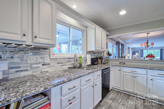 17 Heritage Dr, Lake Wylie, SC 29710 - kitchen featuring dishwasher, ornamental molding, white cabinets, decorative backsplash, and a chandelier