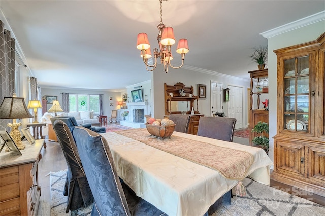 17 Heritage Dr, Lake Wylie, SC 29710 - dining space with a chandelier, crown molding, and wood finished floors
