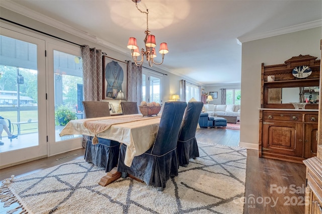 17 Heritage Dr, Lake Wylie, SC 29710 - dining area featuring crown molding, a chandelier, and wood finished floors