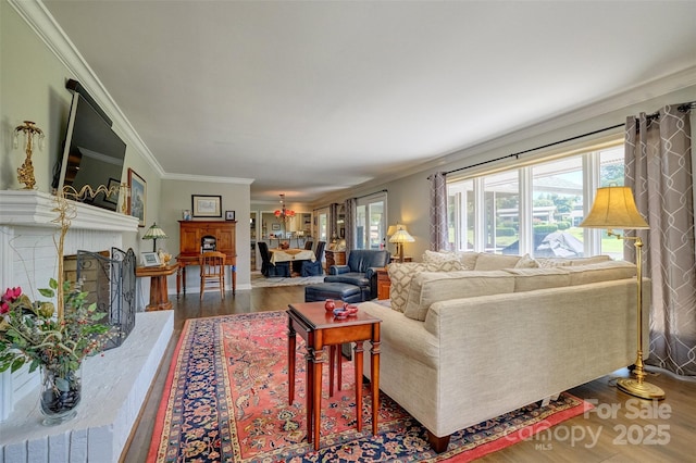 17 Heritage Dr, Lake Wylie, SC 29710 - living room featuring wood finished floors, crown molding, and a fireplace