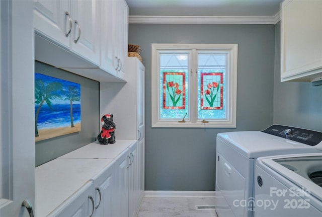 17 Heritage Dr, Lake Wylie, SC 29710 - laundry area with cabinet space, independent washer and dryer, ornamental molding, healthy amount of natural light, and light marble finish flooring