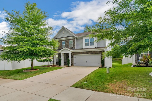 236 Robinwood Ln, Clover, SC 29710 - craftsman-style house with driveway, an attached garage, and stone siding