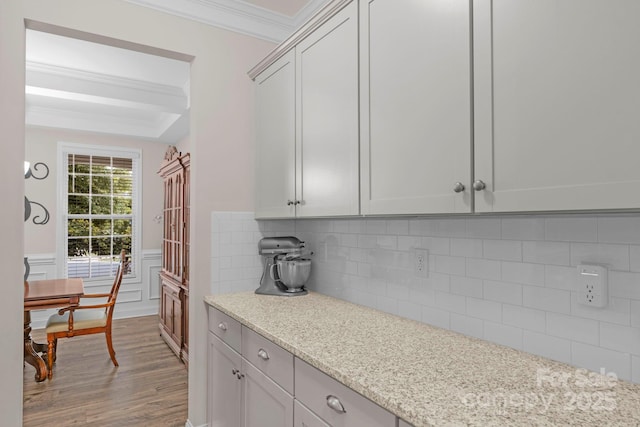 236 Robinwood Ln, Clover, SC 29710 - kitchen with wood finished floors, crown molding, backsplash, wainscoting, and a decorative wall