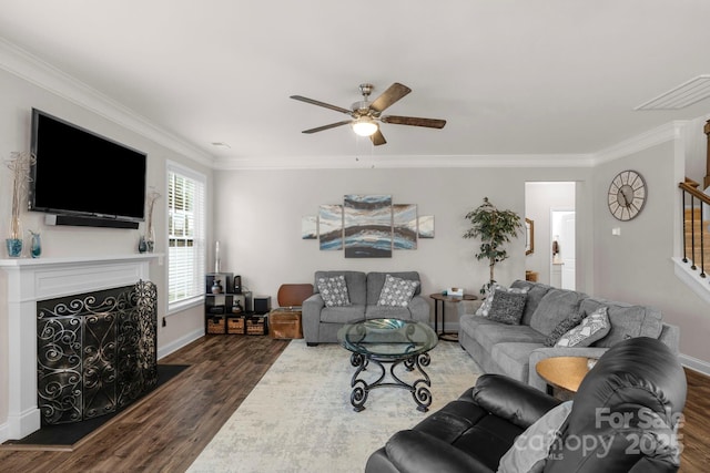 236 Robinwood Ln, Clover, SC 29710 - living area featuring stairway, a ceiling fan, dark wood-style floors, ornamental molding, and a fireplace