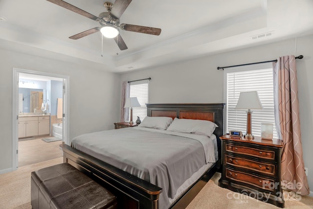 236 Robinwood Ln, Clover, SC 29710 - bedroom with a tray ceiling, ornamental molding, carpet flooring, ensuite bathroom, and a ceiling fan