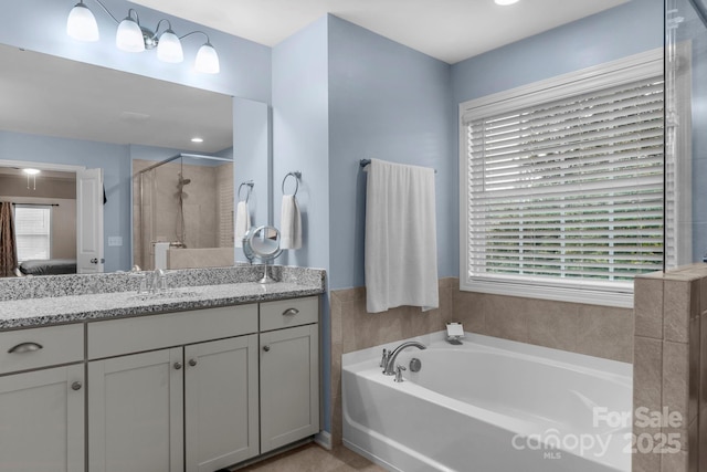 236 Robinwood Ln, Clover, SC 29710 - ensuite bathroom with vanity, a garden tub, and a stall shower