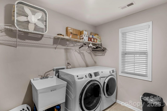 236 Robinwood Ln, Clover, SC 29710 - laundry area with washing machine and clothes dryer and light tile patterned floors