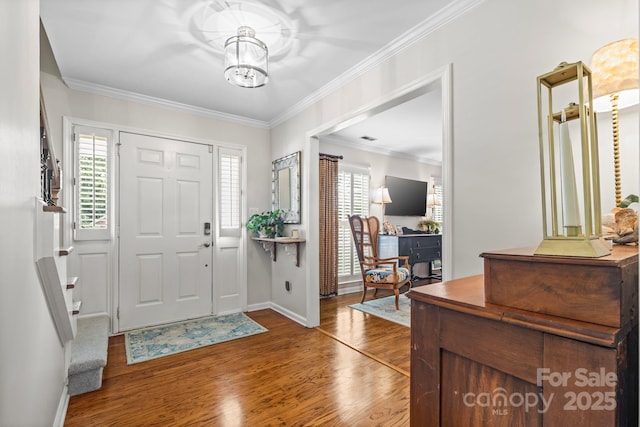 2838 Candleberry Ct, Charlotte, NC 28210 - foyer featuring wood finished floors, a chandelier, and ornamental molding