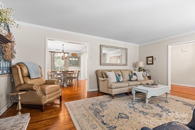 2838 Candleberry Ct, Charlotte, NC 28210 - living area featuring ornamental molding, a chandelier, and wood finished floors