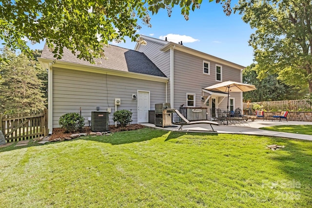 2838 Candleberry Ct, Charlotte, NC 28210 - back of property featuring a patio and a shingled roof
