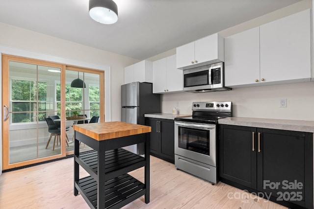 2704 Kool Park Rd NE, Hickory, NC 28601 - kitchen featuring appliances with stainless steel finishes, dark cabinets, white cabinets, and light countertops