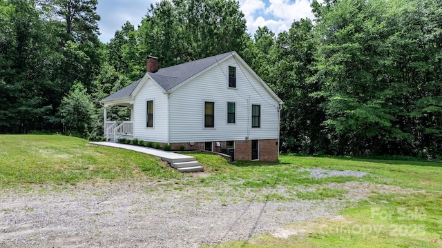 2704 Kool Park Rd NE, Hickory, NC 28601 - view of side of property with a yard and a chimney