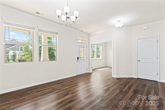 15213 Red Canoe Way, Charlotte, NC 28278 - spare room with a chandelier, dark wood-type flooring, and ornamental molding