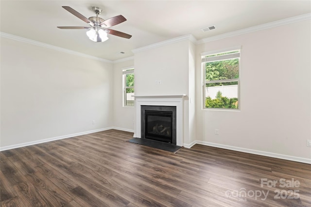 15213 Red Canoe Way, Charlotte, NC 28278 - unfurnished living room with a glass covered fireplace, dark wood finished floors, crown molding, and ceiling fan