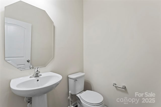 15213 Red Canoe Way, Charlotte, NC 28278 - bathroom featuring toilet and a sink