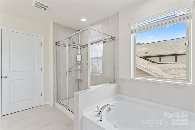 15213 Red Canoe Way, Charlotte, NC 28278 - bathroom with a shower stall, a bath, recessed lighting, and tile patterned floors