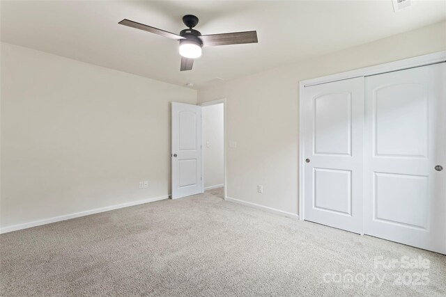 15213 Red Canoe Way, Charlotte, NC 28278 - unfurnished bedroom featuring carpet flooring, a closet, and ceiling fan