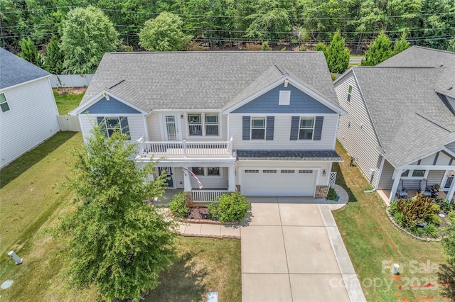 15213 Red Canoe Way, Charlotte, NC 28278 - view of front of house featuring driveway, a garage, roof with shingles, and covered porch
