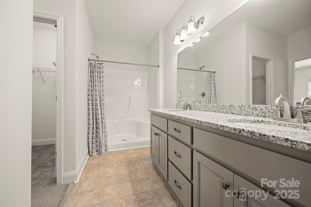 321 Benjamins Way Unit 48, Hendersonville, NC 28792 - full bath with a shower stall, double vanity, a spacious closet, and stone finish floors