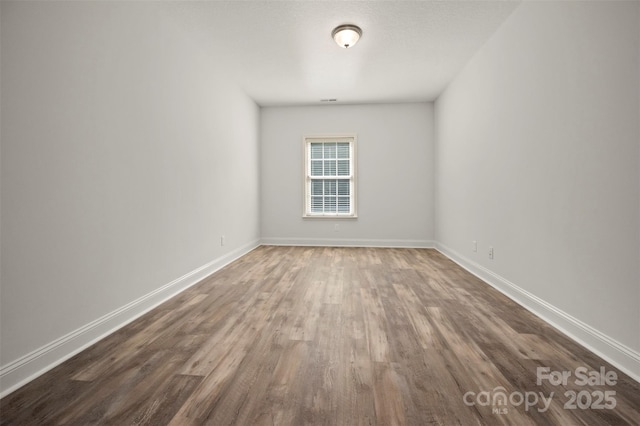 321 Benjamins Way Unit 48, Hendersonville, NC 28792 - spare room featuring wood finished floors and baseboards